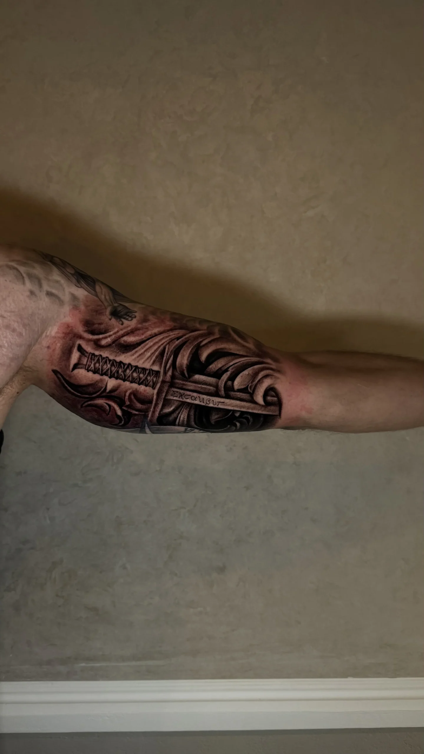 Black and gray realism sword tattoo ruvens